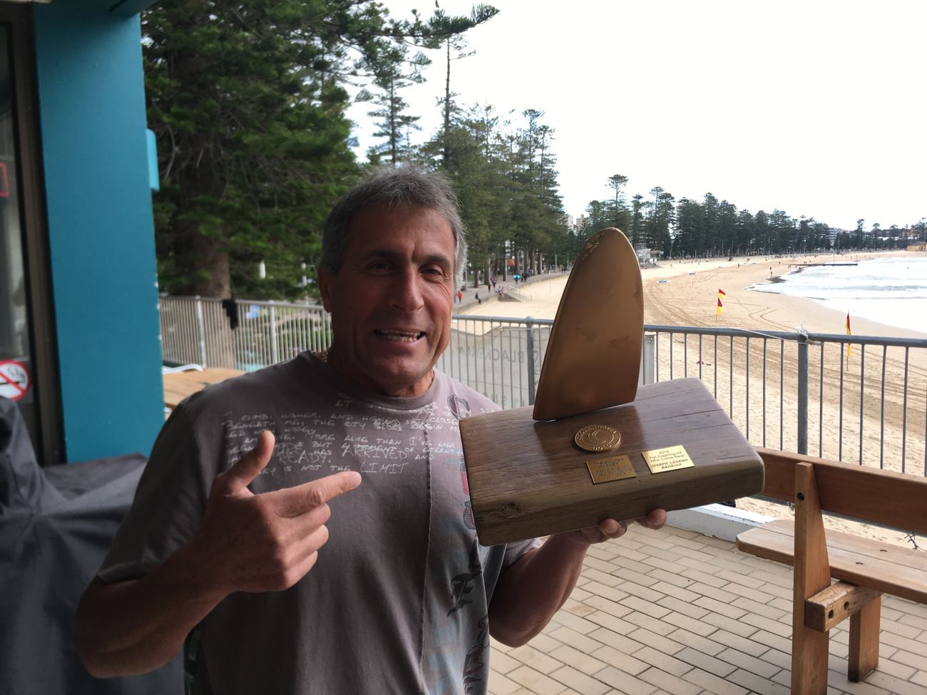 June 2017 — Joe B. on the balcony, Manly beach behind